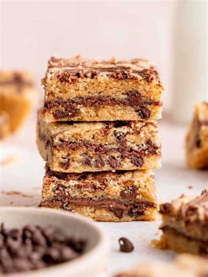 Nutella cookie bar split in half on a piece of parchment.